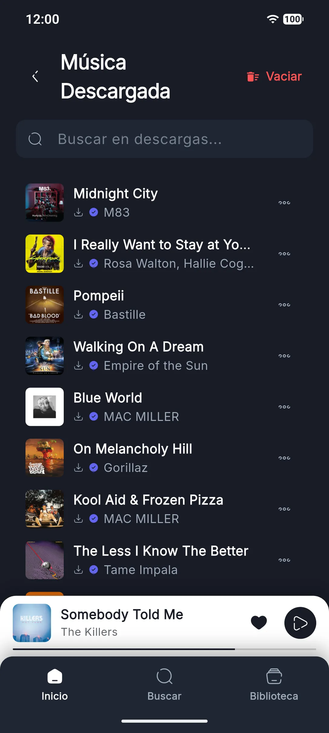 Música descargada: lista de canciones guardadas en el teléfono con buscador y el botón Vaciar.